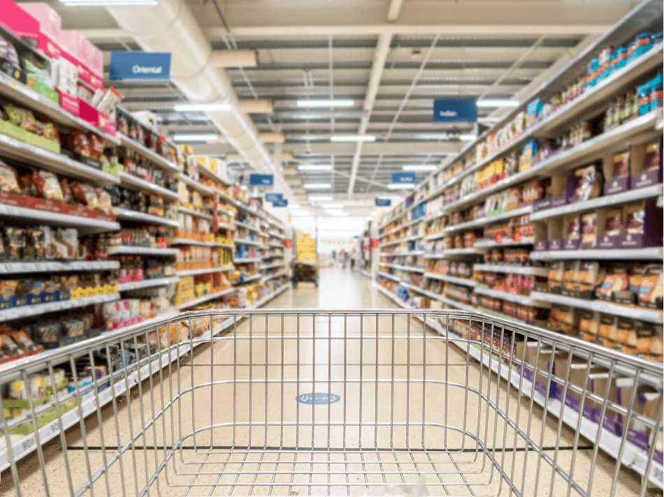 A trolley down a supermarket aisle