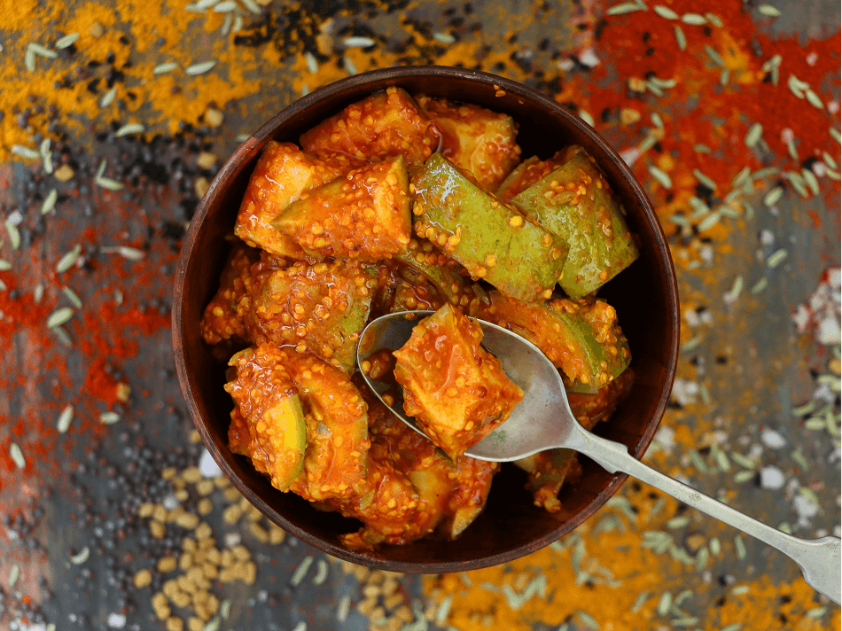 A bowl of green mango chutney